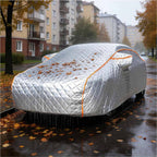 Silver hail-proof full car cover with orange trim on sedan in heavy rain, rainproof, hailproof, sunscreen, dustproof and scratch-resistant