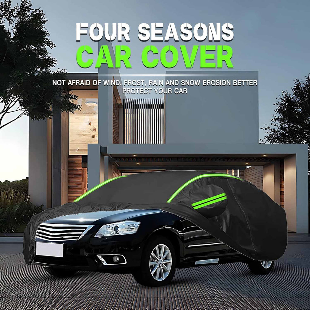 Black four seasons full car cover with green reflective trim on sedan parked outside modern house, not afraid of wind frost rain and snow erosion